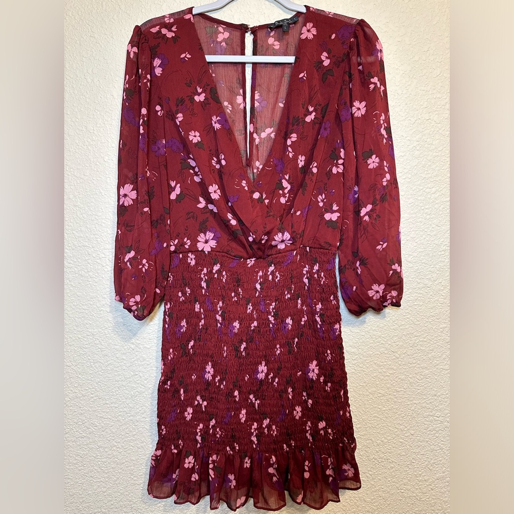 Floral burgundy mini dress with ruched detail.